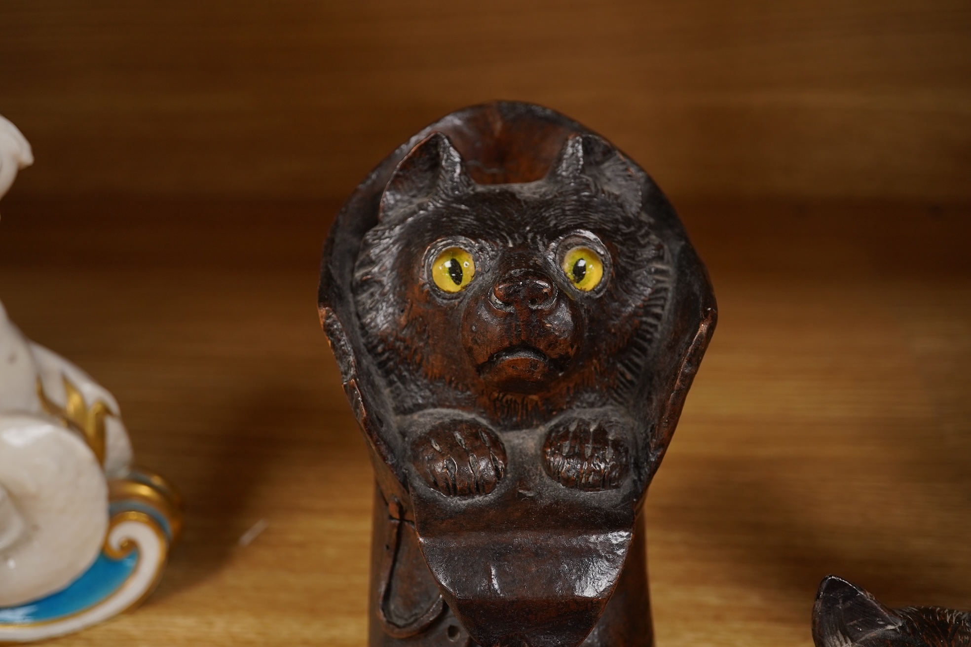 A Black Forest carving of a kitten in a boot inkwell and another car inkwell, tallest 15cm